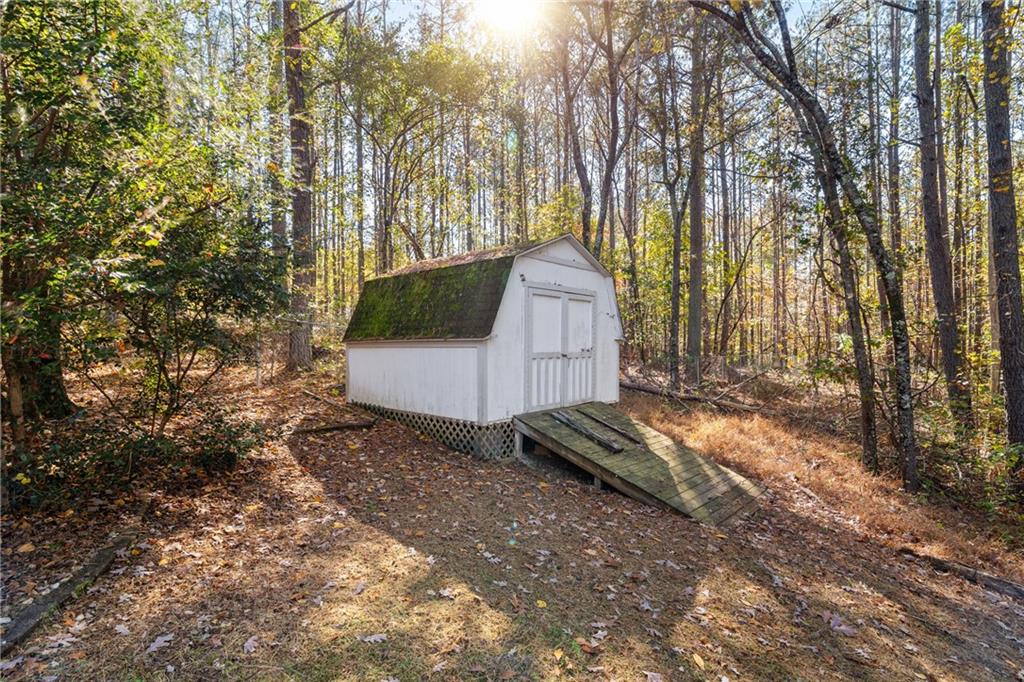 204 Red Fox Court Canton, GA 30114 - Photo 43 of 51 a backyard of a house with lots of green space
