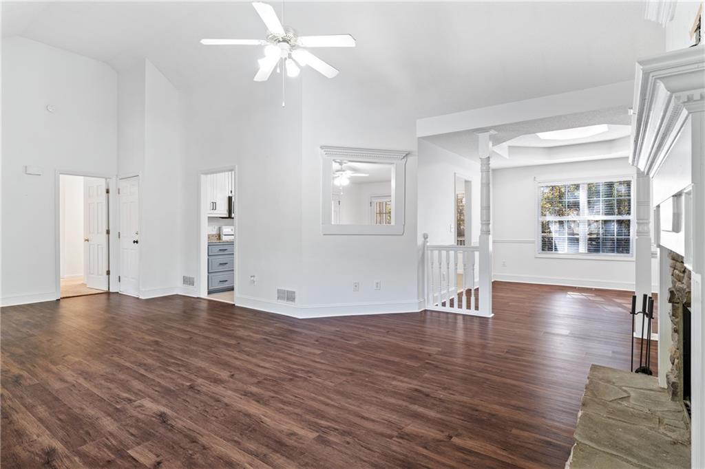 204 Red Fox Court Canton, GA 30114 - Photo 8 of 51 a view of an empty room with window and wooden floor
