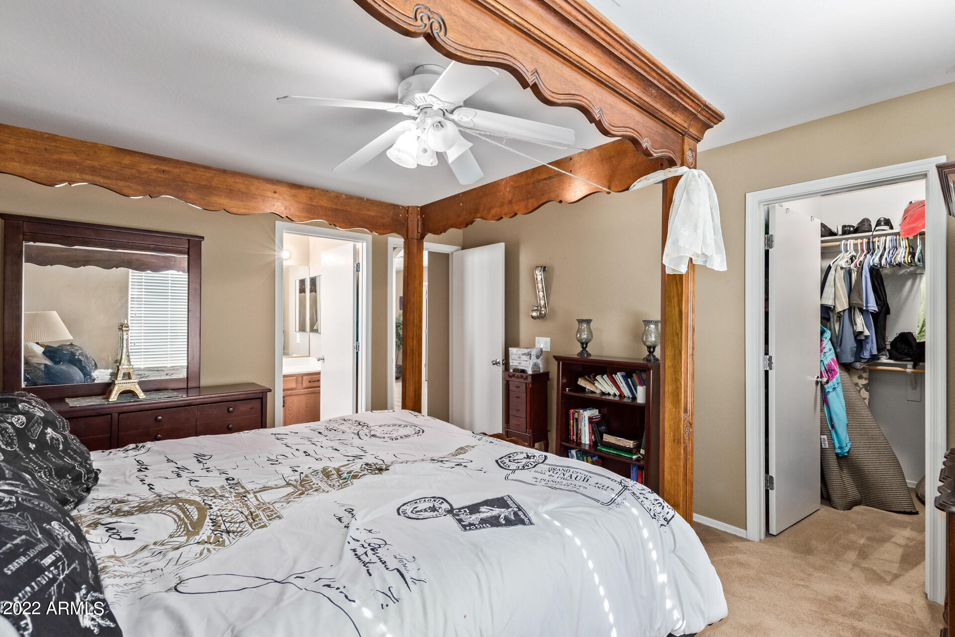 2742 South Powell Road Apache Junction, AZ 85119 - Photo 21 of 34 a bedroom with a bed and a large mirror with a flat tv screen