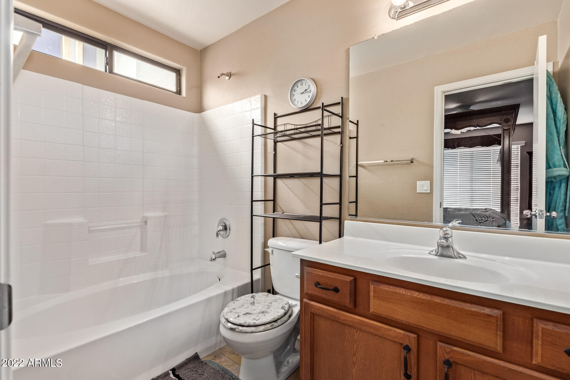 2742 South Powell Road Apache Junction, AZ 85119 - Photo 22 of 34 a bathroom with a sink toilet a mirror and bathtub