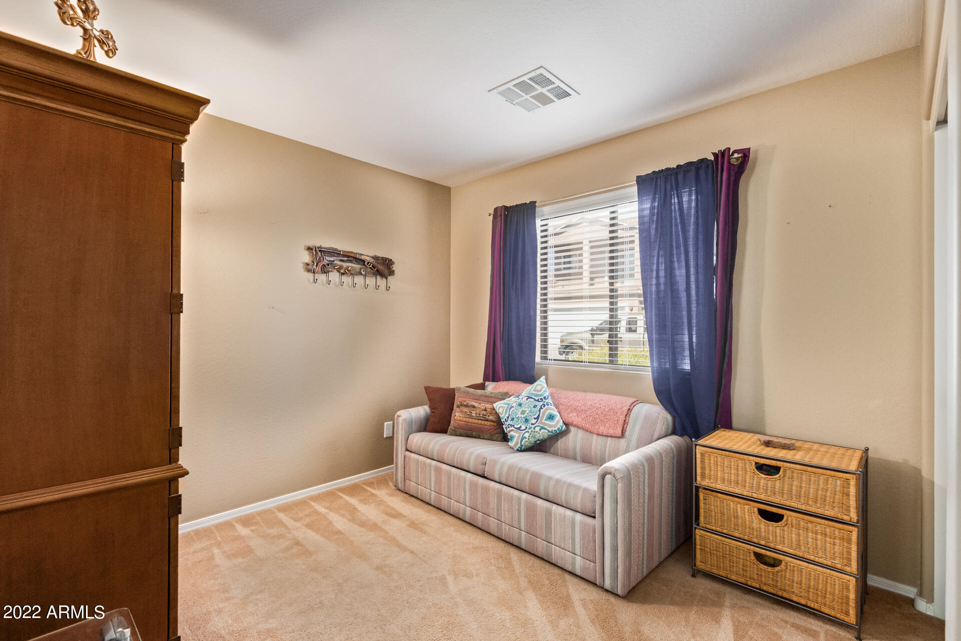 2742 South Powell Road Apache Junction, AZ 85119 - Photo 23 of 34 a bedroom with furniture and window