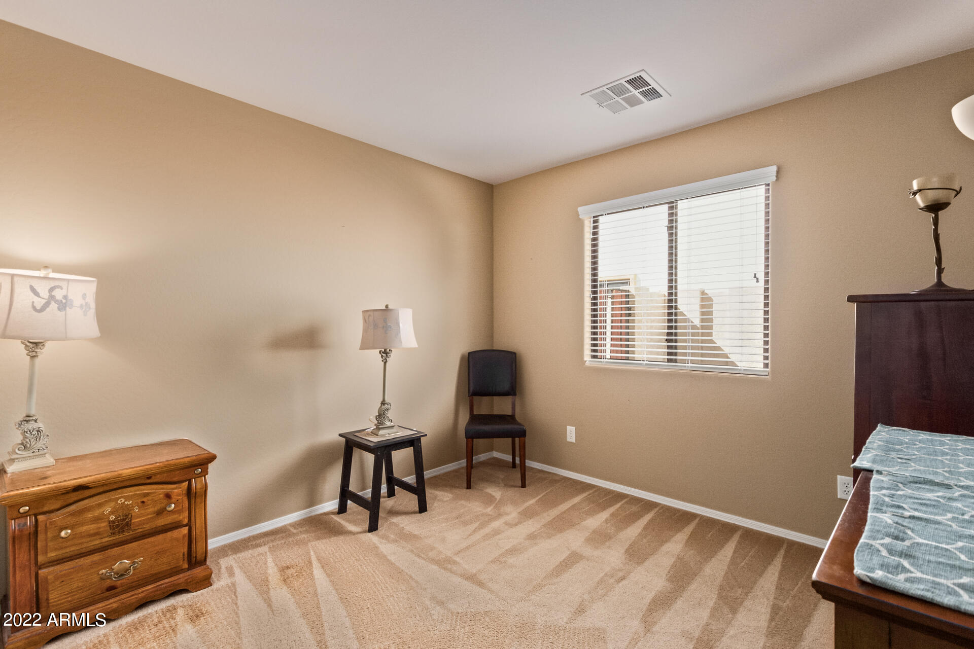 2742 South Powell Road Apache Junction, AZ 85119 - Photo 25 of 34 a bedroom with a bed and a window