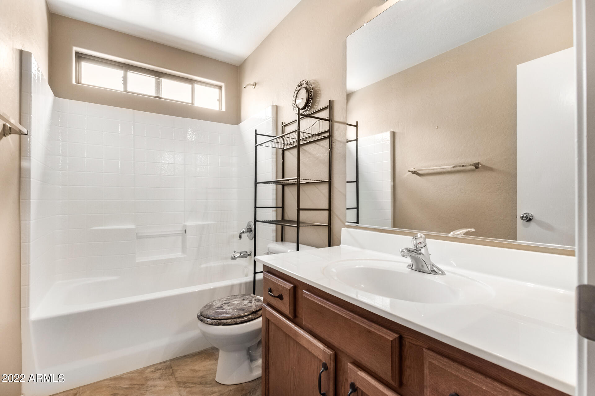 2742 South Powell Road Apache Junction, AZ 85119 - Photo 27 of 34 a bathroom with a sink a toilet and shower