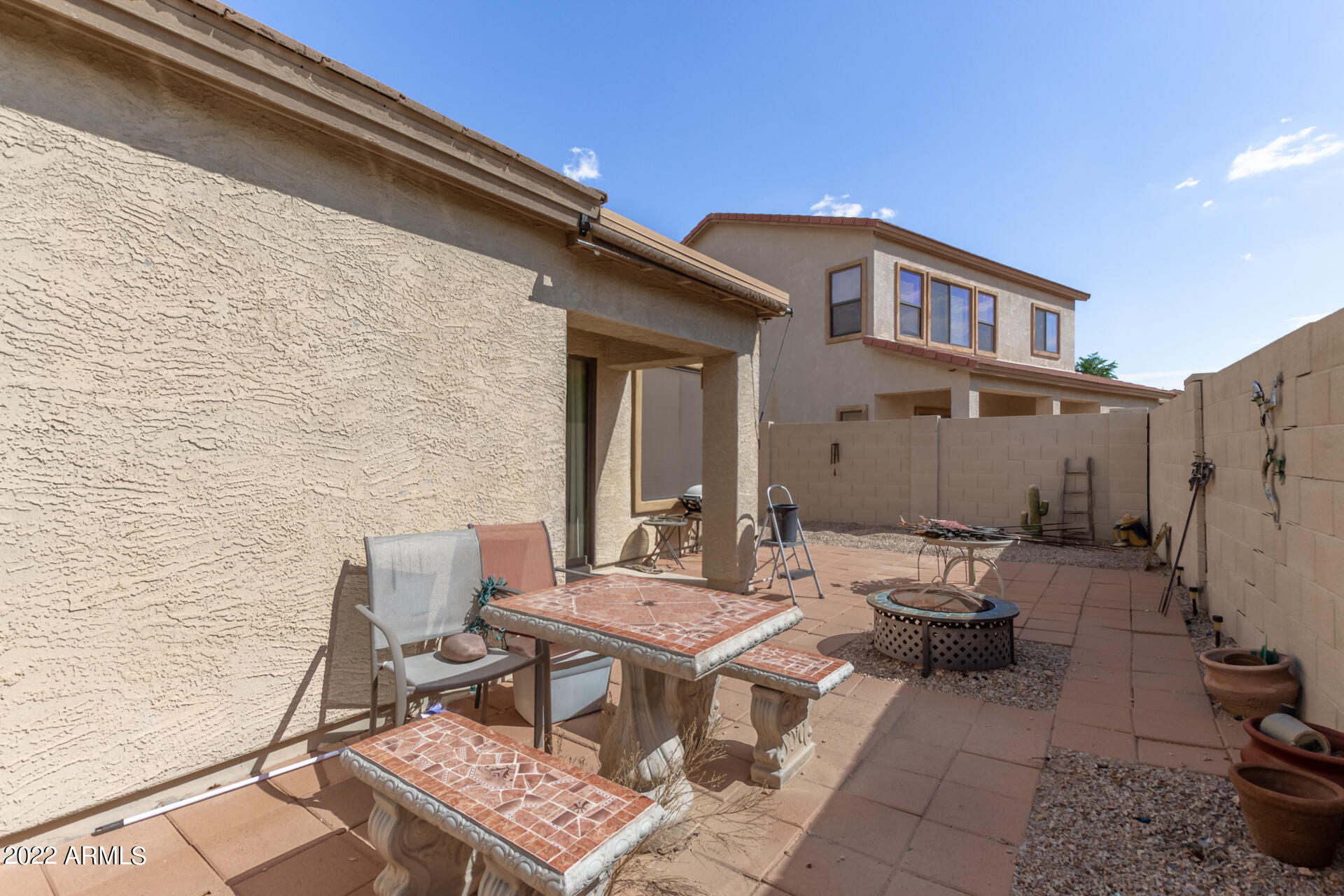 2742 South Powell Road Apache Junction, AZ 85119 - Photo 32 of 34 a backyard of a house with outdoor seating