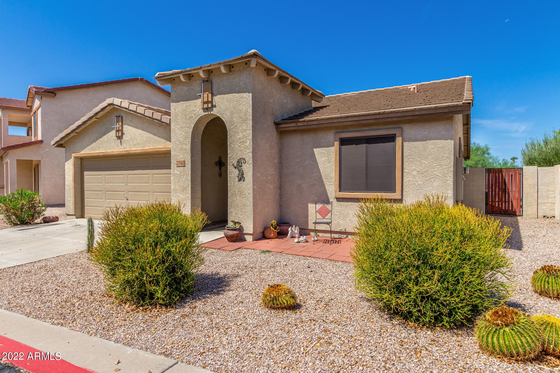2742 South Powell Road Apache Junction, AZ 85119 - Photo 4 of 34 a front view of a house with garden