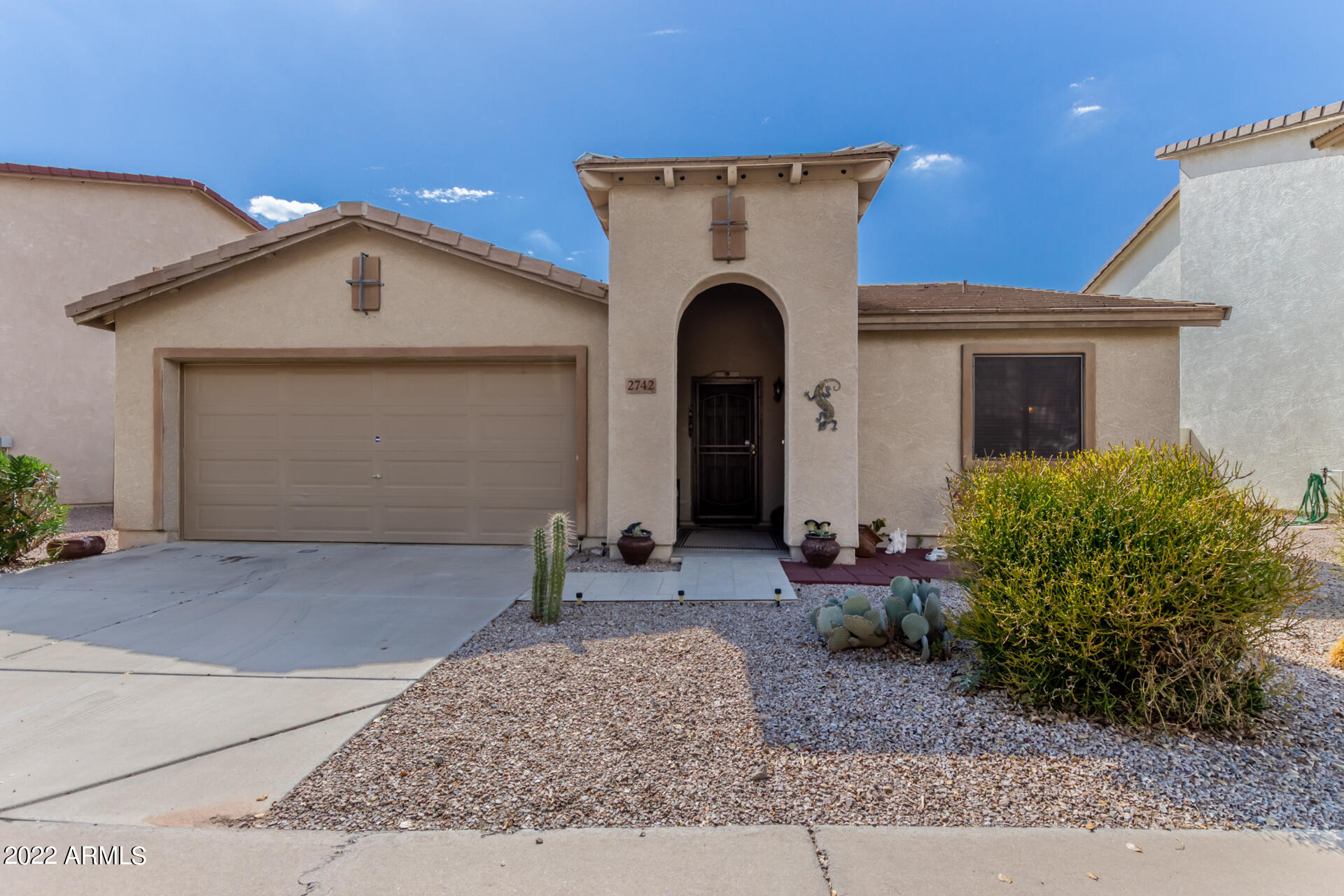 2742 South Powell Road Apache Junction, AZ 85119 - Photo 7 of 34 a front view of a house with garden