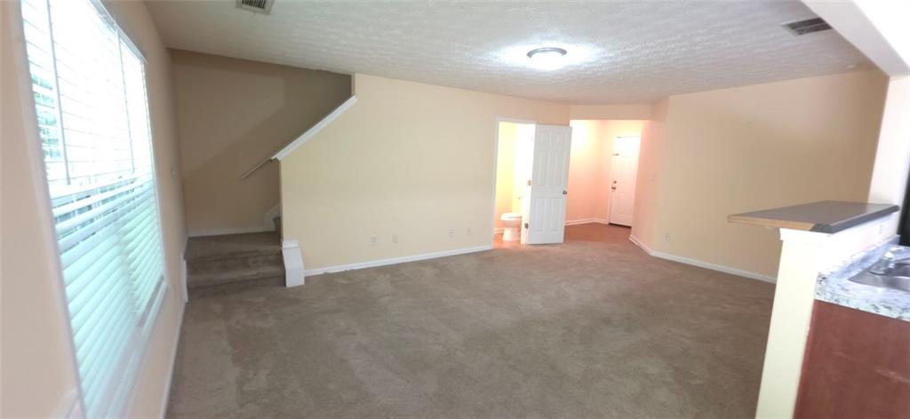 465 Little Creek Road Southeast Lawrenceville, GA 30045 - Photo 2 of 13 a view of an empty room with a window