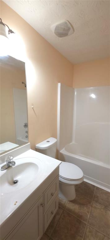 465 Little Creek Road Southeast Lawrenceville, GA 30045 - Photo 10 of 13 a bathroom with a sink a toilet and a large mirror