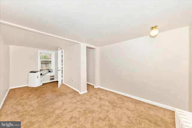 a bathroom with a toilet sink vanity and mirror