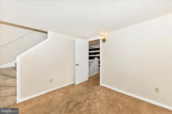 a view of a livingroom with wooden floor and a window