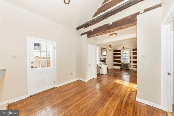 a view of a livingroom with wooden floor