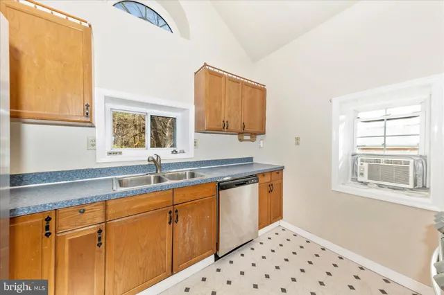 a kitchen with a sink and cabinets