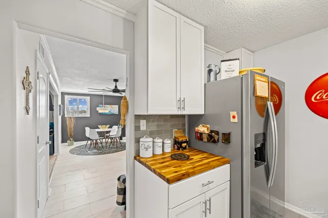 a kitchen with a stove and a refrigerator