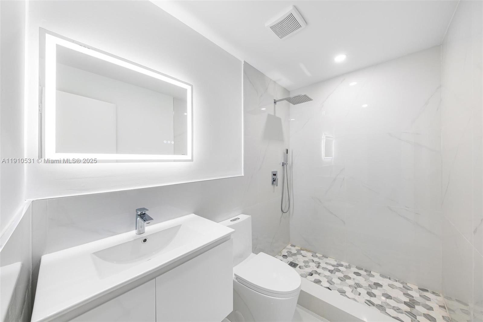 2250 Northwest 95th Street Miami, FL 33147 - Photo 13 of 26 a bathroom with a sink a toilet and shower