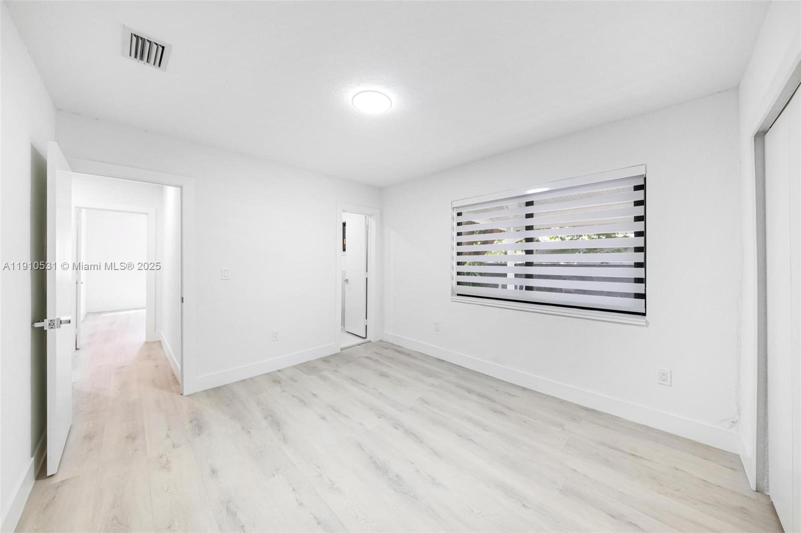 2250 Northwest 95th Street Miami, FL 33147 - Photo 18 of 26 a view of an empty room with a window