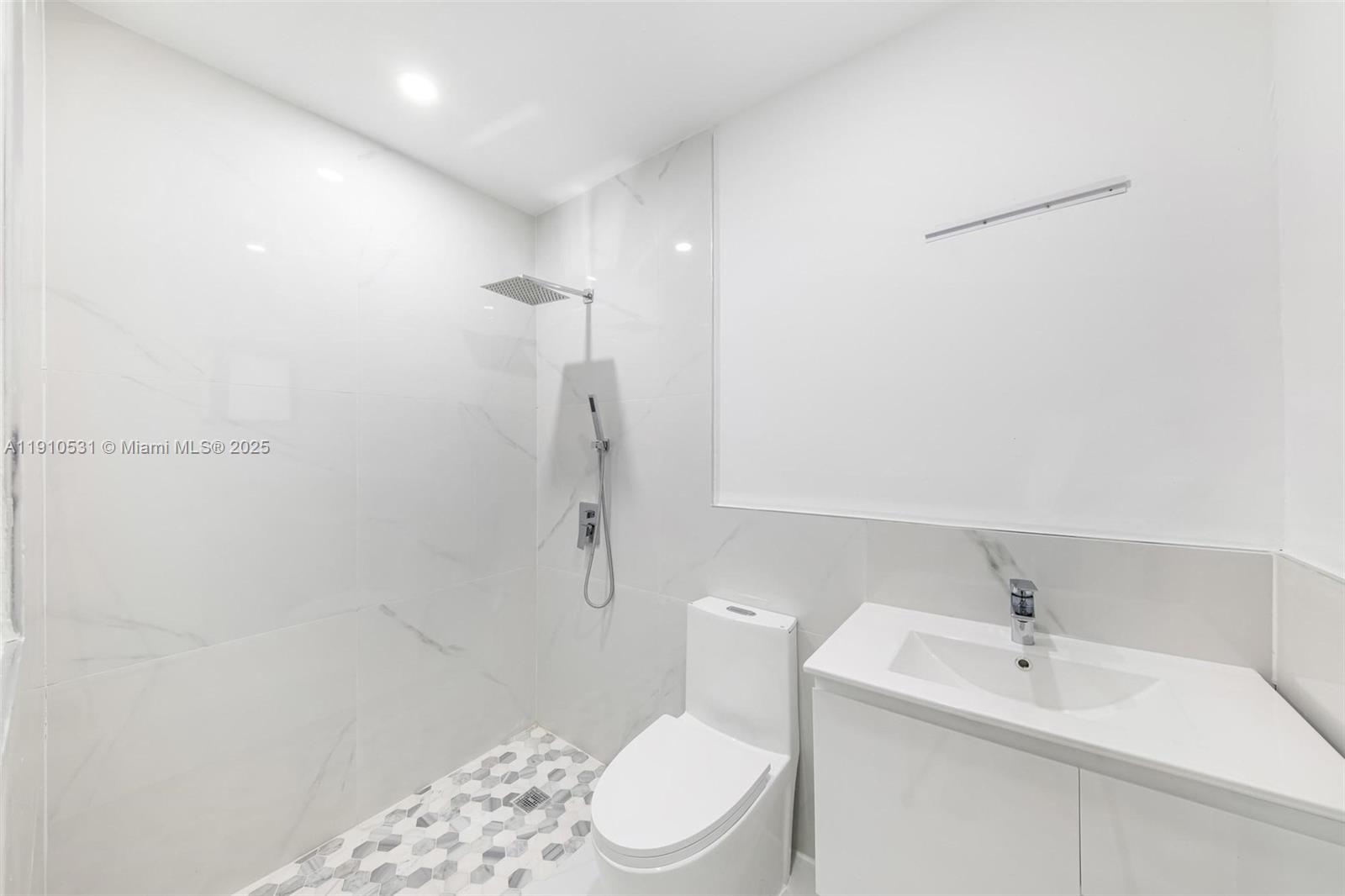 2250 Northwest 95th Street Miami, FL 33147 - Photo 20 of 26 a bathroom with a sink a toilet and shower