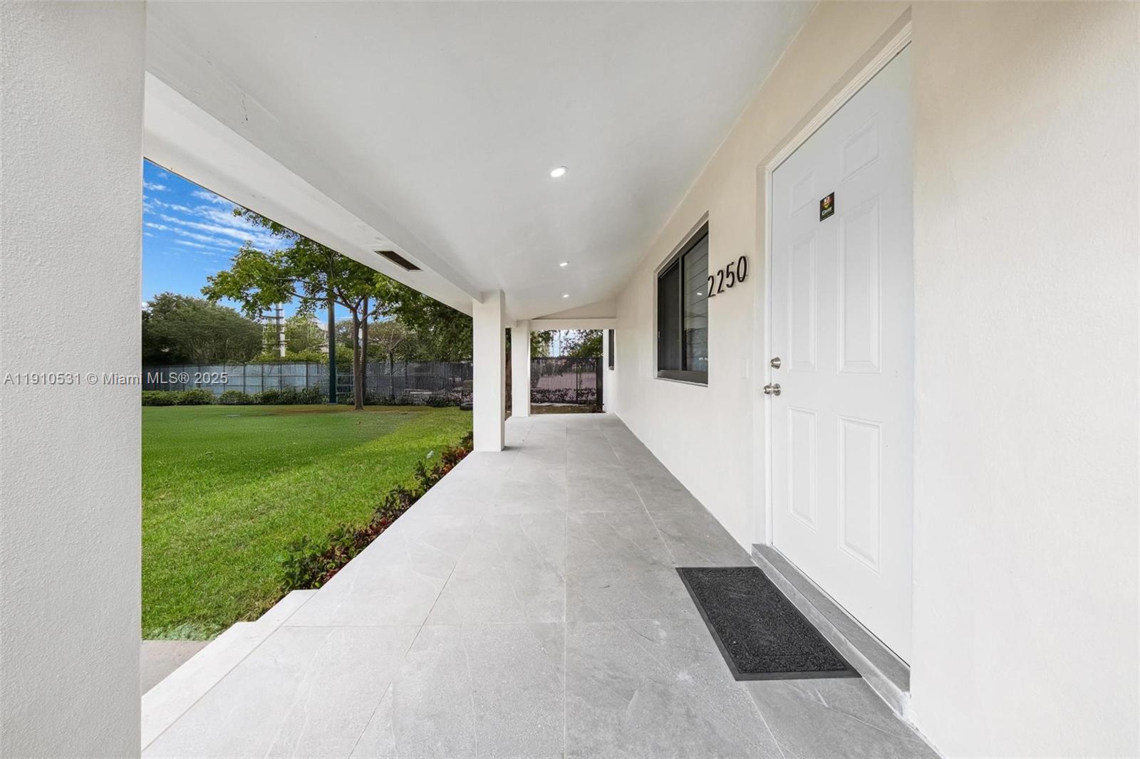 2250 Northwest 95th Street Miami, FL 33147 - Photo 2 of 26 a view of a patio with a yard