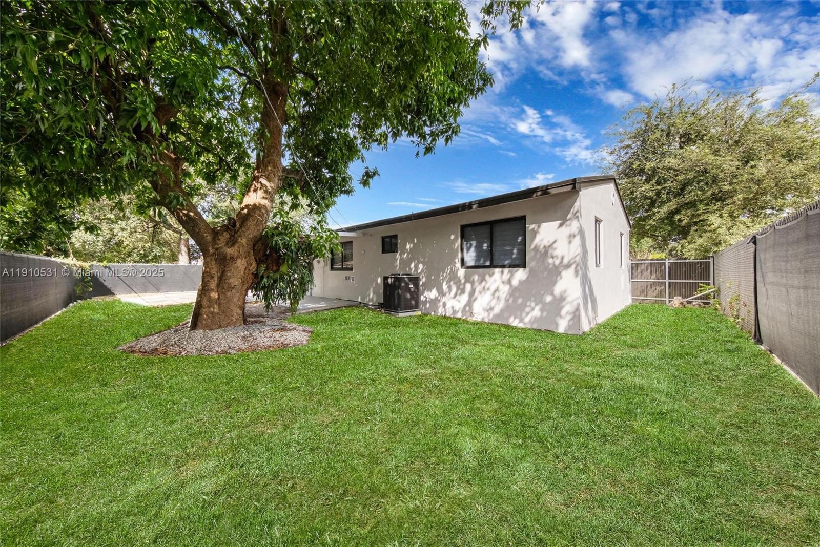 2250 Northwest 95th Street Miami, FL 33147 - Photo 26 of 26 a front view of a house with garden