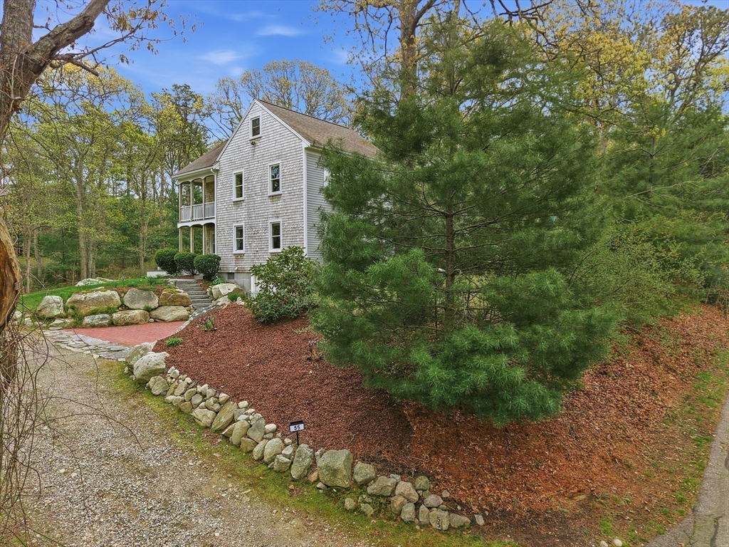 55 Ridgeview Drive Falmouth, MA 02540 - Photo 6 of 32 a front view of a house with a yard