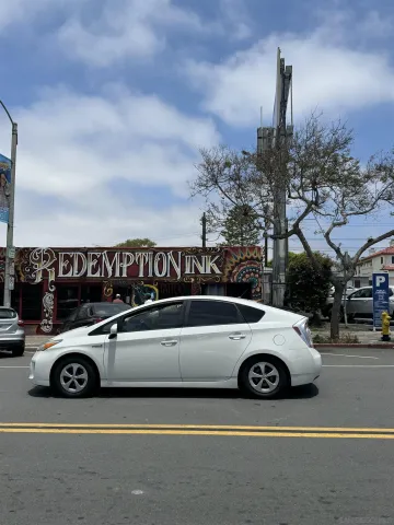 a view of a cars park in front of a building