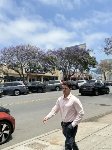 a view of a city street with cars