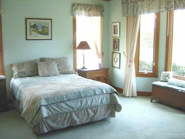 1120 Orange Factory Road Bahama, NC 27503 - Photo 6 of 10 1st floor master suite has awesome view of lake!! Features bay windows, ceiling fan, his and her walk in closets & whirlpool. Other