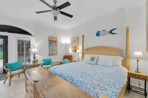 a bedroom with a large bed and a window