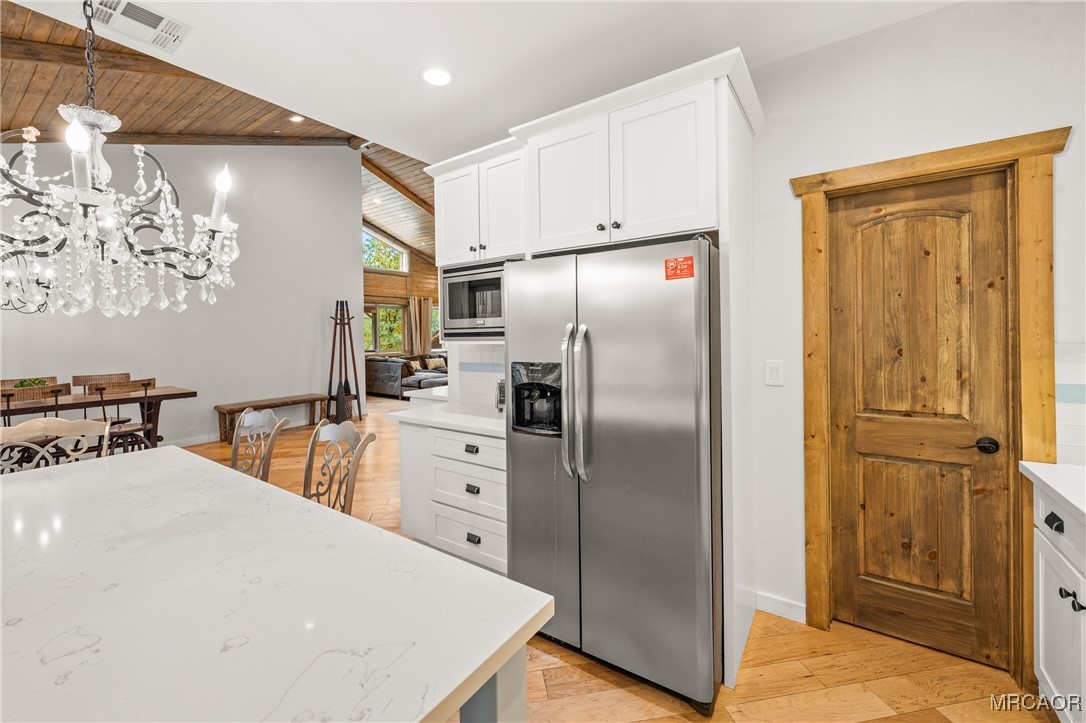 855 Conklin Road Big Bear Lake, CA 92315 - Photo 18 of 44 a kitchen with stainless steel appliances a refrigerator and a stove