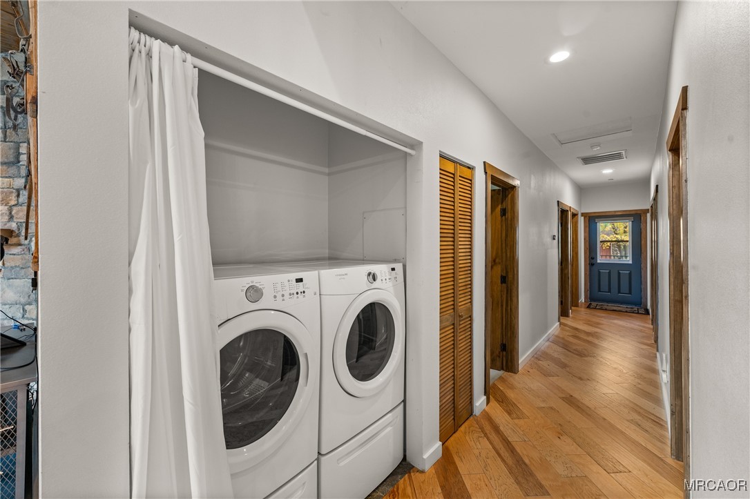 855 Conklin Road Big Bear Lake, CA 92315 - Photo 20 of 44 a view of a hallway with washer and dryer