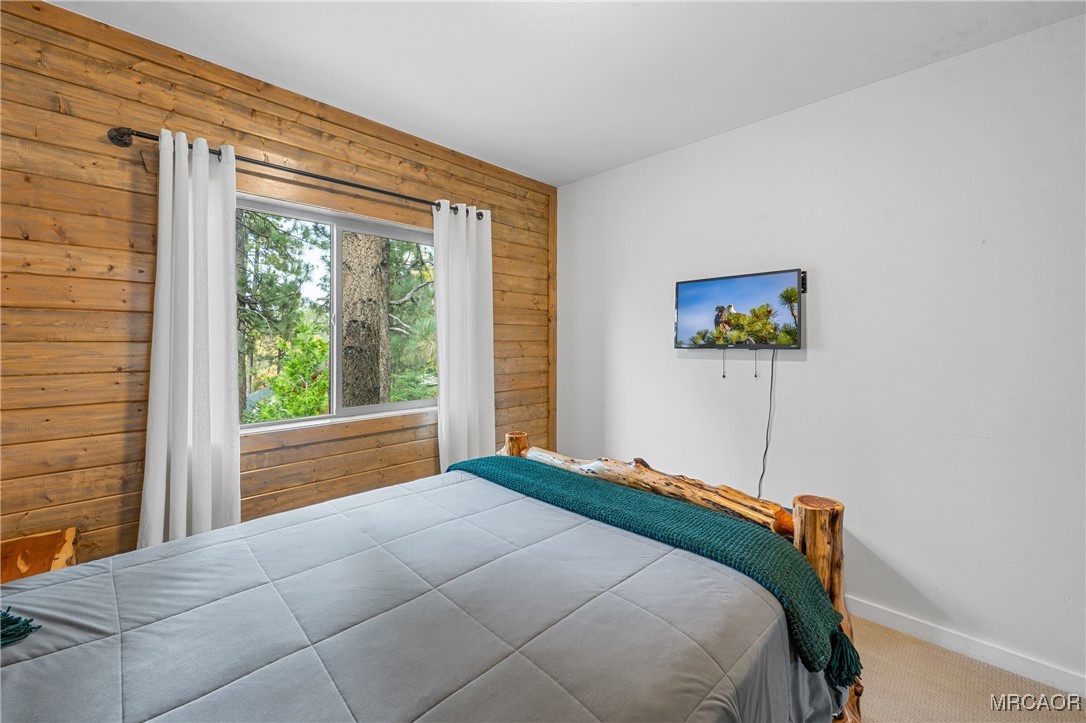 855 Conklin Road Big Bear Lake, CA 92315 - Photo 23 of 44 a bedroom with a bed and a window