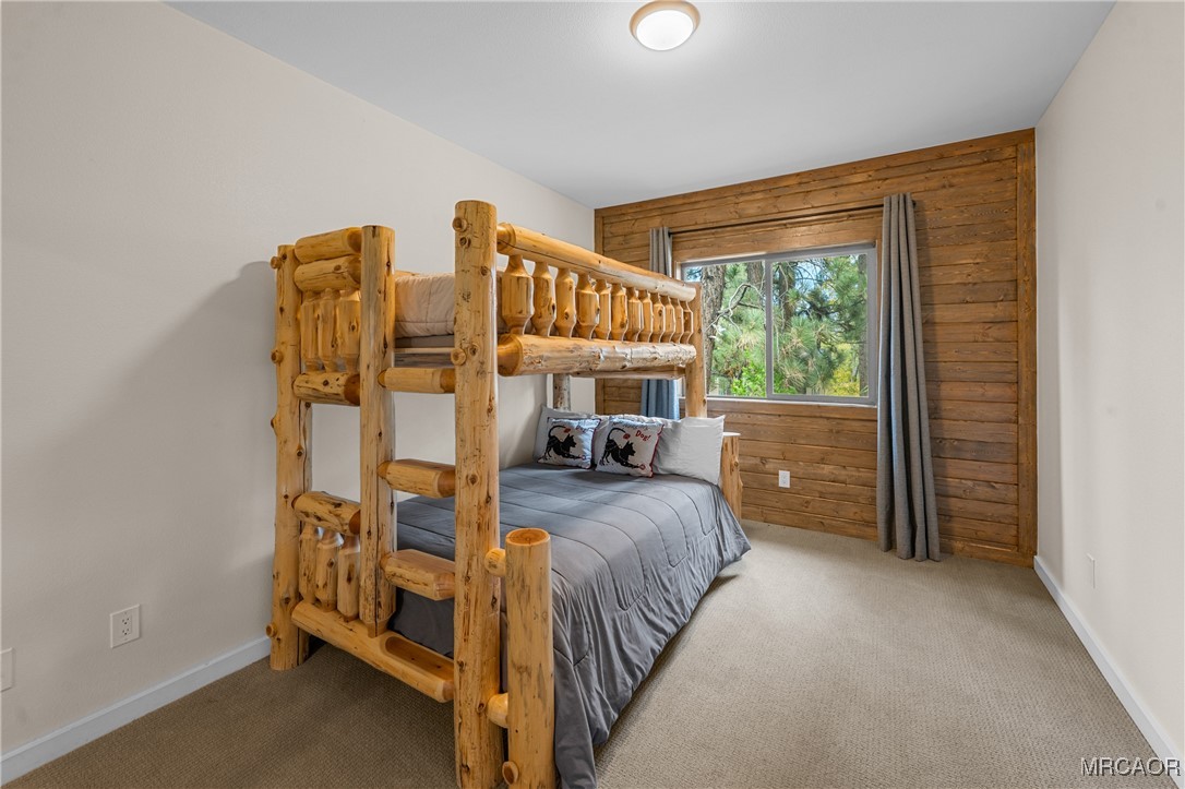 855 Conklin Road Big Bear Lake, CA 92315 - Photo 26 of 44 a bedroom with furniture and a window