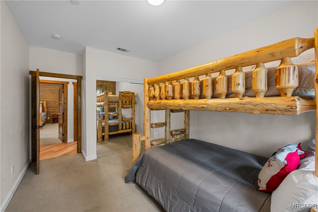 855 Conklin Road Big Bear Lake, CA 92315 - Photo 27 of 44 a bedroom with furniture and a window