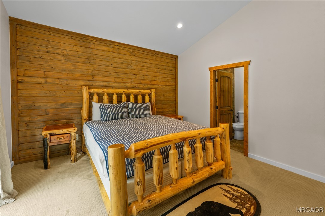 855 Conklin Road Big Bear Lake, CA 92315 - Photo 31 of 44 a bedroom with a bed and chair