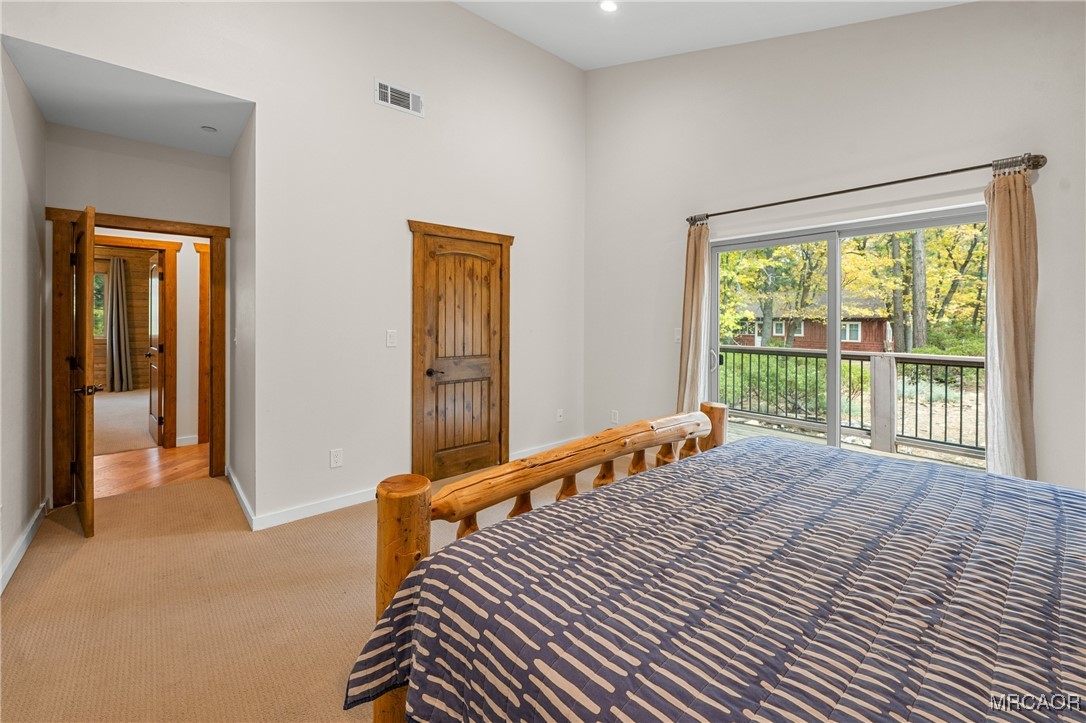 855 Conklin Road Big Bear Lake, CA 92315 - Photo 33 of 44 a bedroom with a bed and a large window