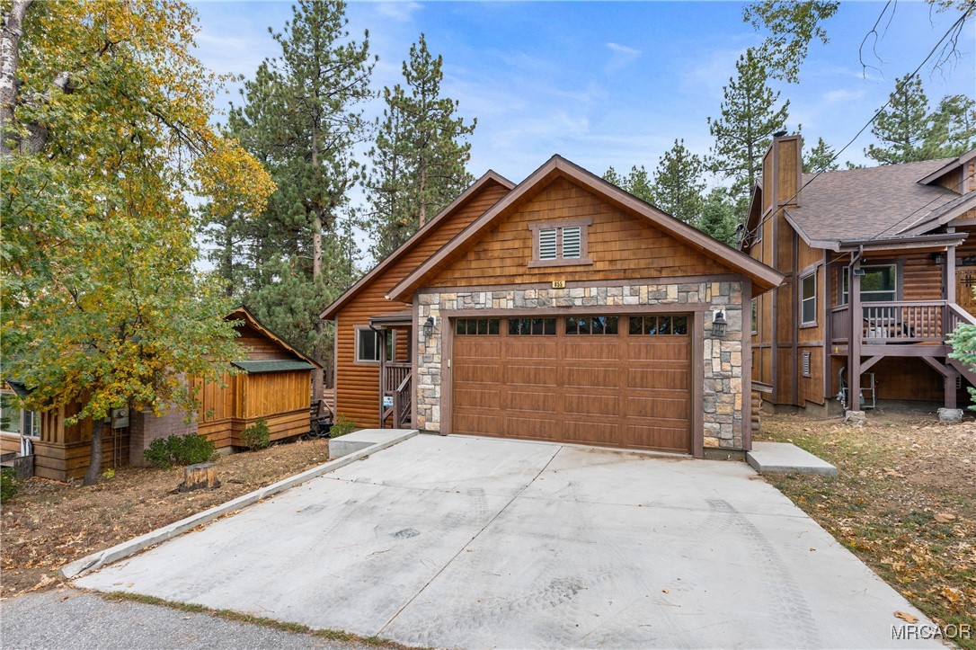 855 Conklin Road Big Bear Lake, CA 92315 - Photo 43 of 44 a front view of a house with a yard and garage