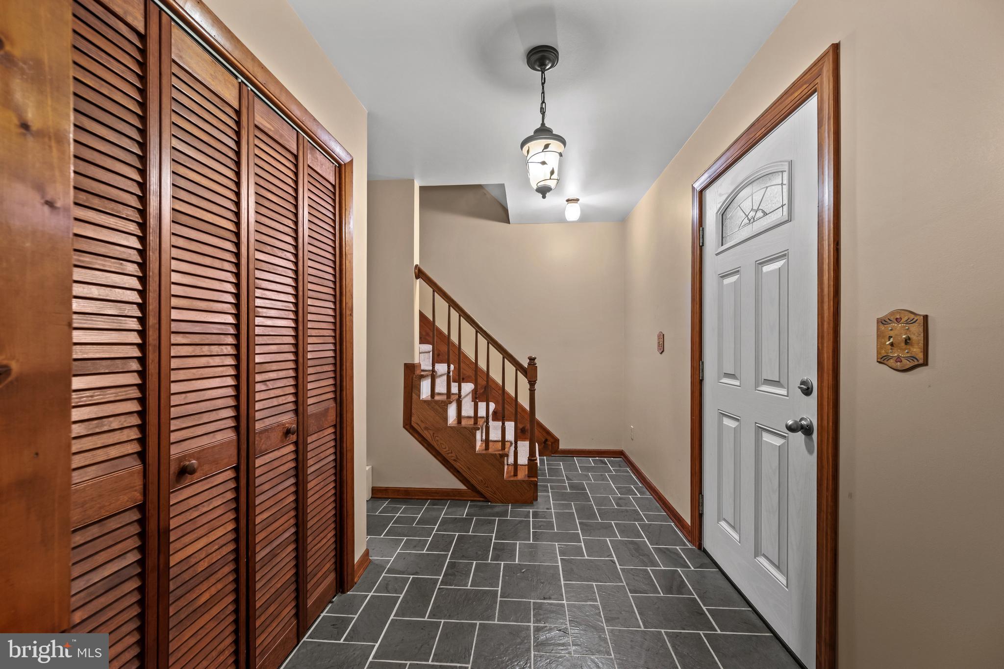 5313 Wentz Road Manchester, MD 21102 - Photo 29 of 51 a view of a hallway with wooden floor and staircase