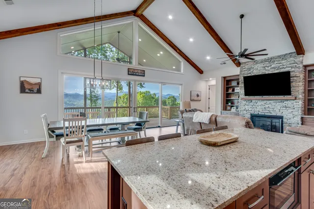 a kitchen with a table chairs and a stove