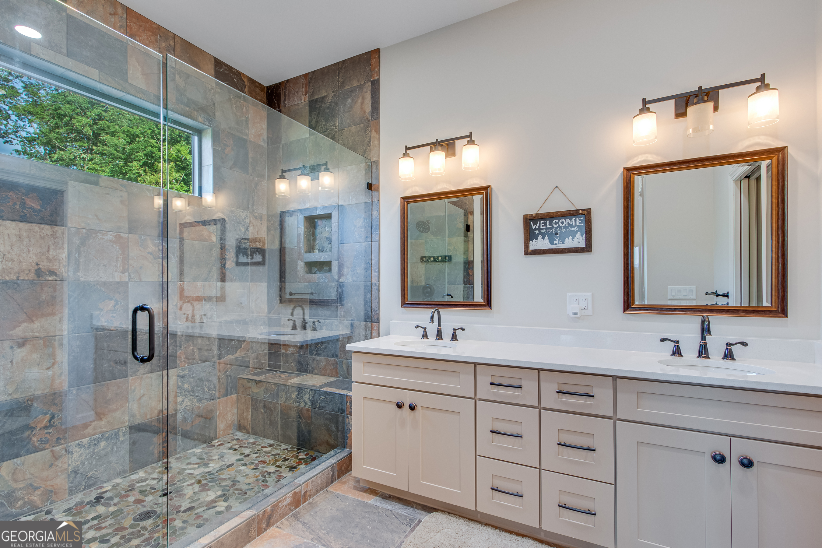 103 Bent Grass Way Clayton, GA 30525 - Photo 16 of 28 a bathroom with a double vanity sink mirror and shower