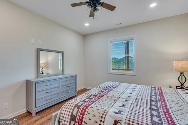 a bedroom with a bed and a dresser