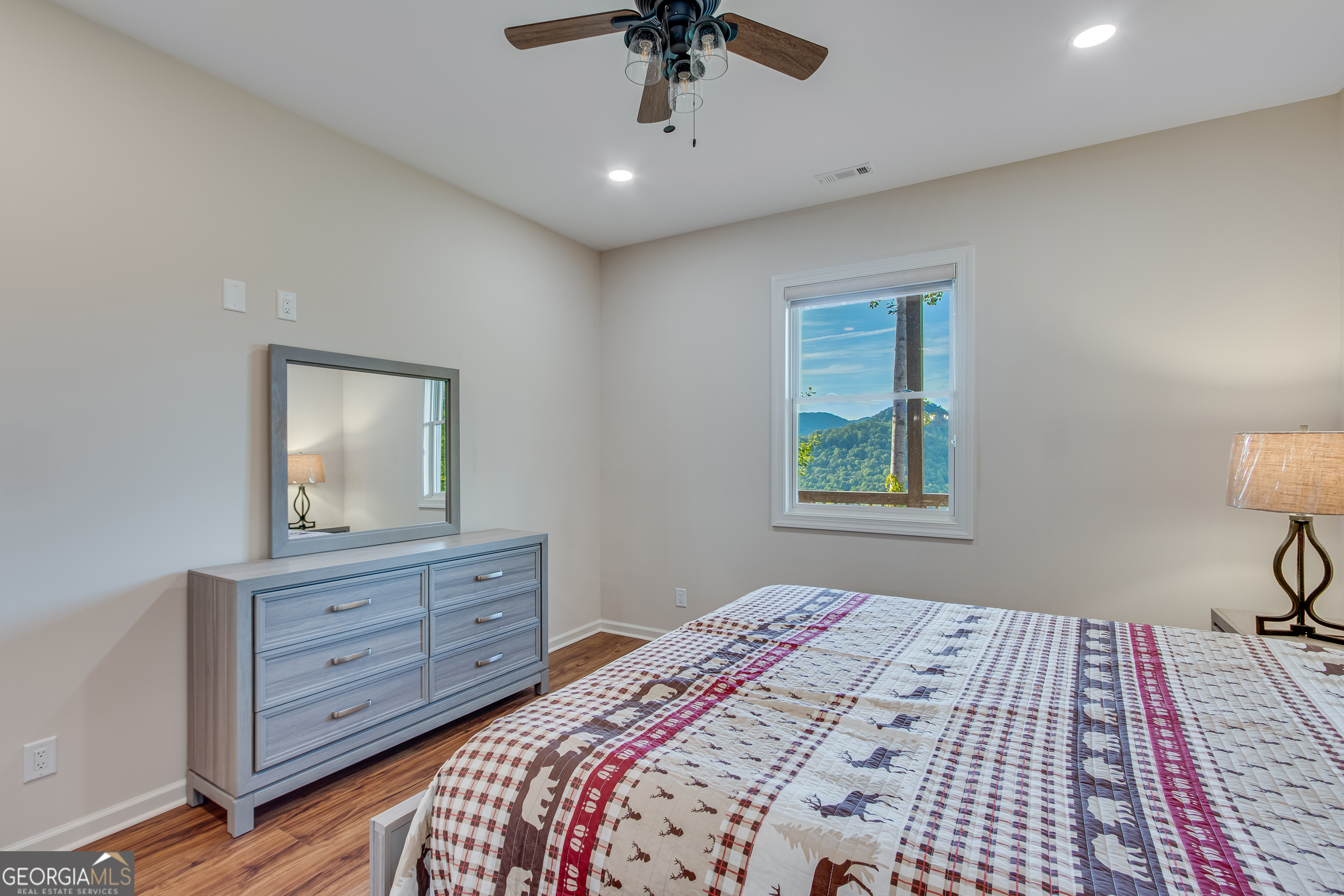 103 Bent Grass Way Clayton, GA 30525 - Photo 22 of 28 a bedroom with a bed and a dresser