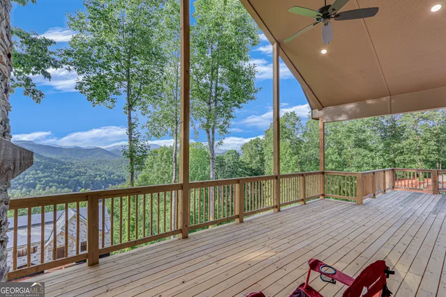 a view of a balcony with wooden floor