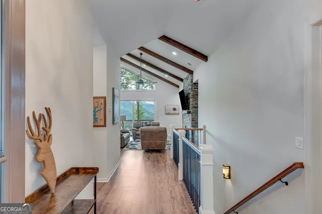 a view of living room and workspace