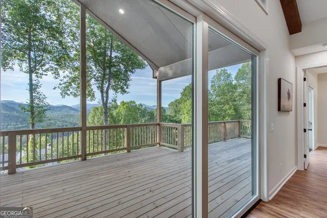 a view of a balcony with wooden floor