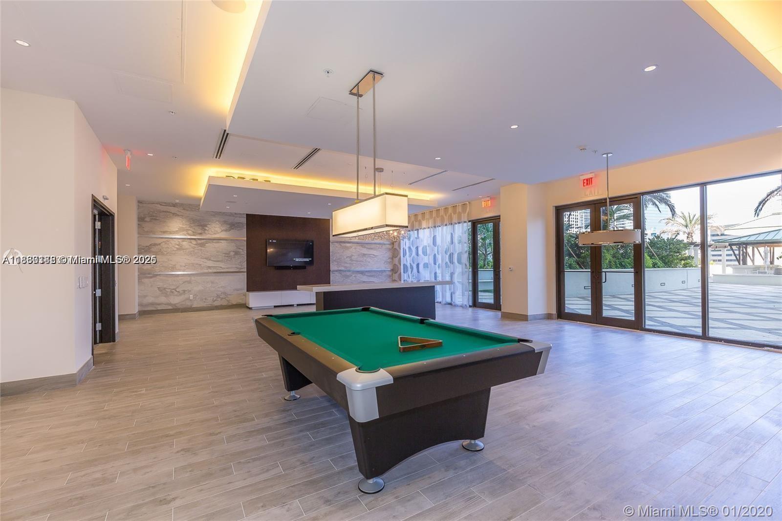 999 Southwest 1st Avenue, Unit 2705 Miami, FL 33130 - Photo 10 of 24 a room with pool table windows and outdoor view