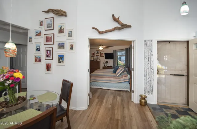 a view of a dining room with furniture and wooden floor
