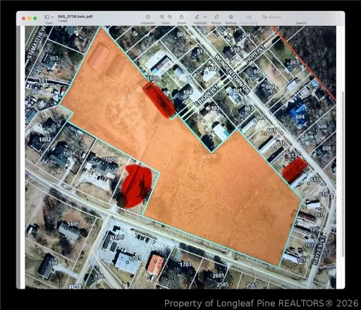 a view of a lake in middle of a field