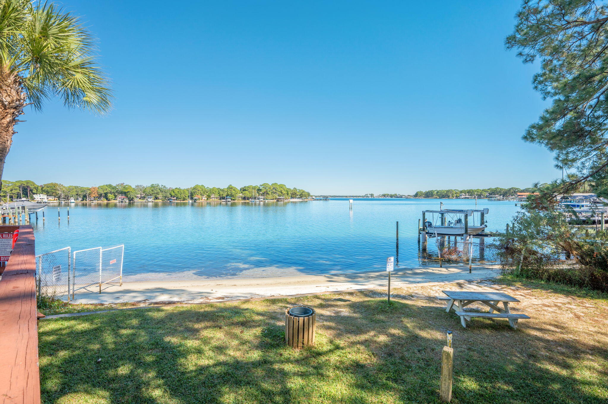 a view of a lake with houses in the background