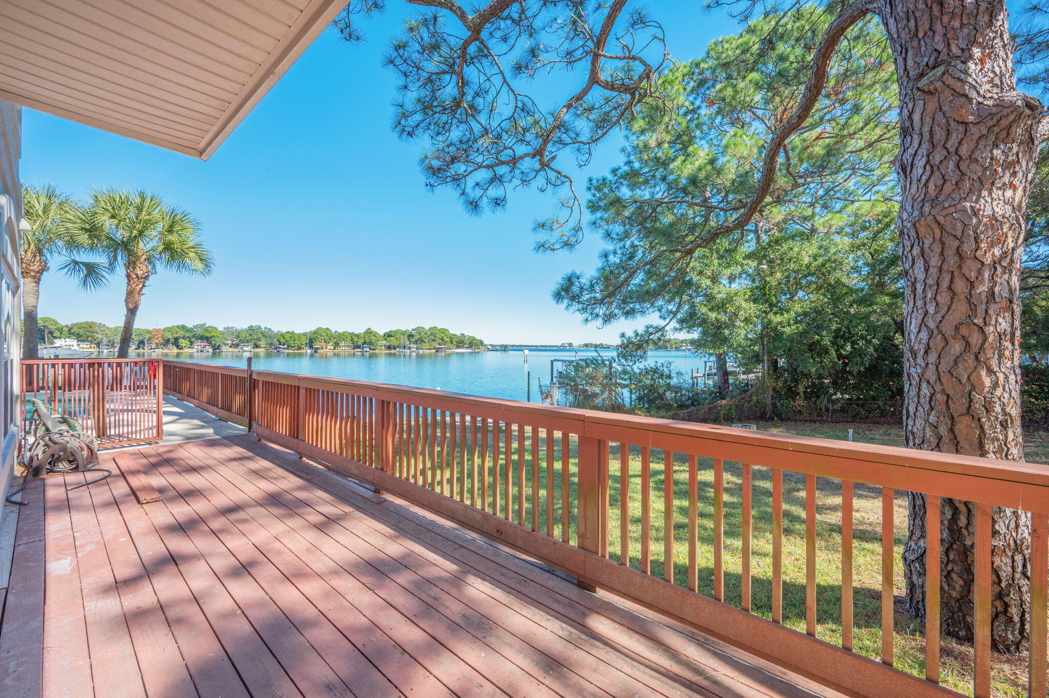 5 Laguna Street, Unit 104 Fort Walton Beach, FL 32548 - Photo 15 of 40 a view of a wooden deck with a yard