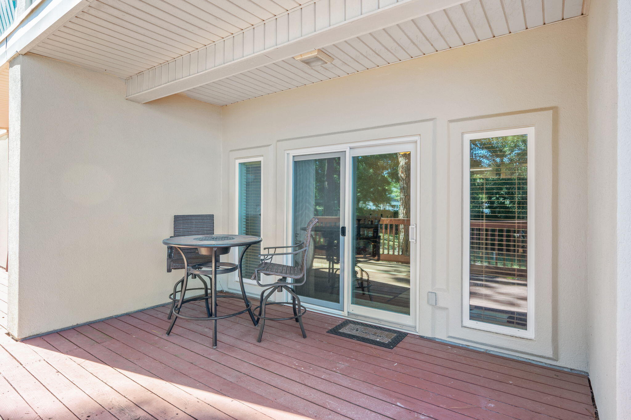 5 Laguna Street, Unit 104 Fort Walton Beach, FL 32548 - Photo 16 of 40 a dining room with wooden floor and glass door