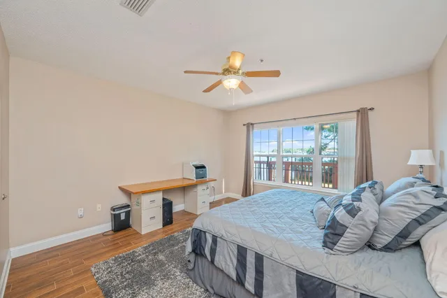 a bedroom with a bed and a table